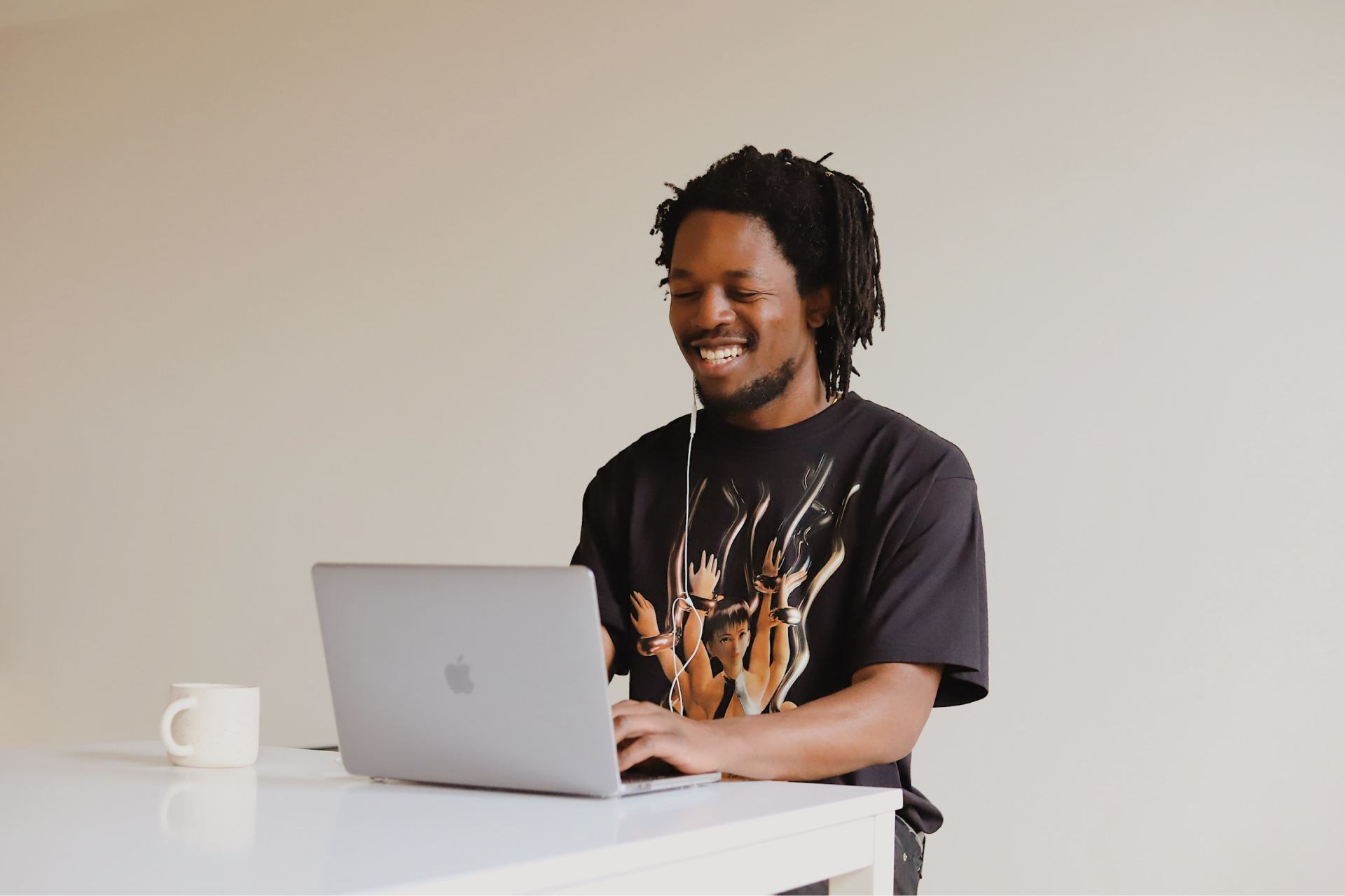 A thinking in front of his laptop